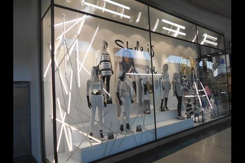 In the women’s window the tubes are a cat’s cradle-like affair and the bulk are used to frame the left-hand side of the scene.